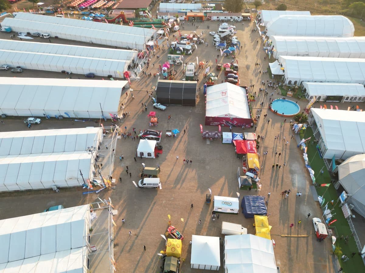 Aerial view of rows of exhibitor tents and booths at an outdoor expo